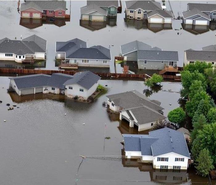 a neighborhood with standing flood waters